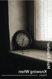 Clock sitting on window sill. 